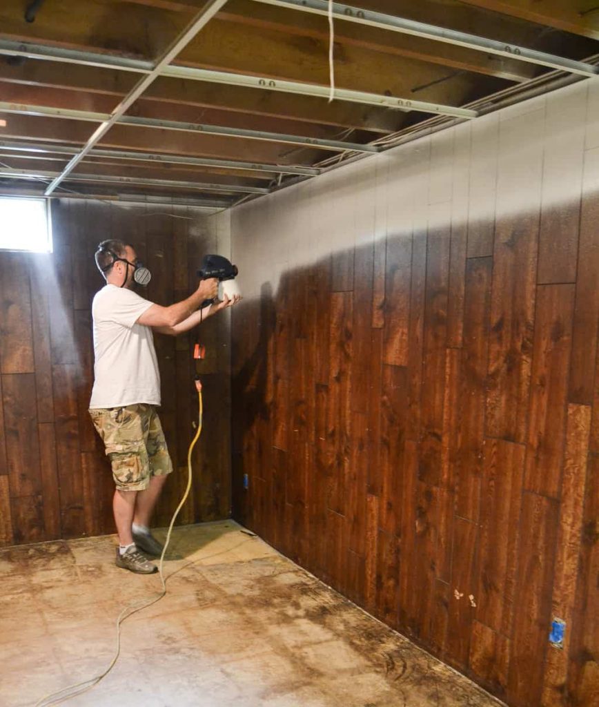 The Easy Way To Paint Paneling - If you have paneling in your home and would like to change it but don't have a big budget, paint it! This post will show you The Easy Way To Paint Paneling!