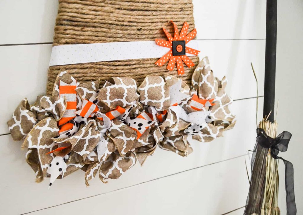 Looking for a unique way to add a fall wreath to your home? This Witch Hat Wreath For Fall is easy to make and gives a whole new meaning to fall wreath.