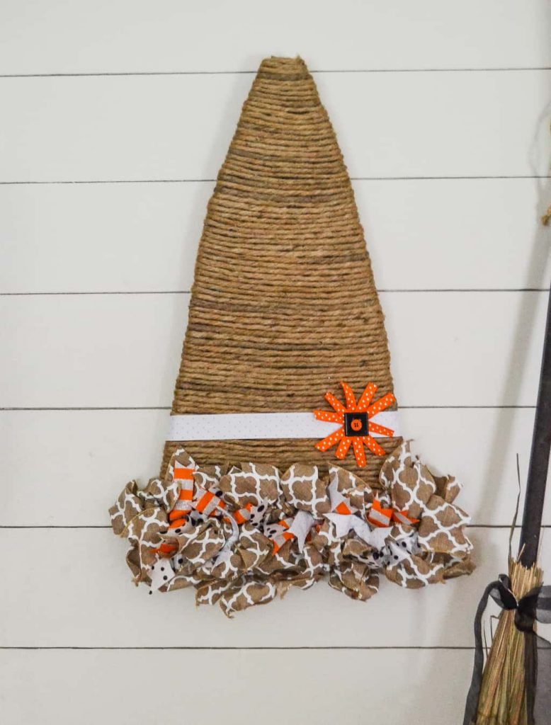 Looking for a unique way to add a fall wreath to your home? This Witch Hat Wreath For Fall is easy to make and gives a whole new meaning to fall wreath.