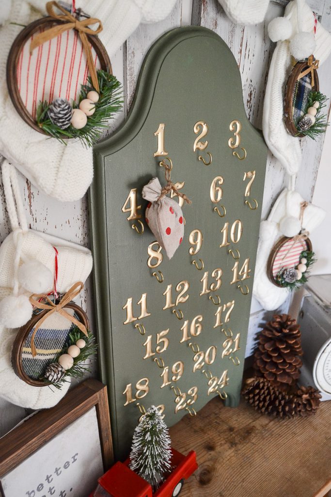Rustic DIY Advent Calendar with scrap wood, metal numbers and small hooks!