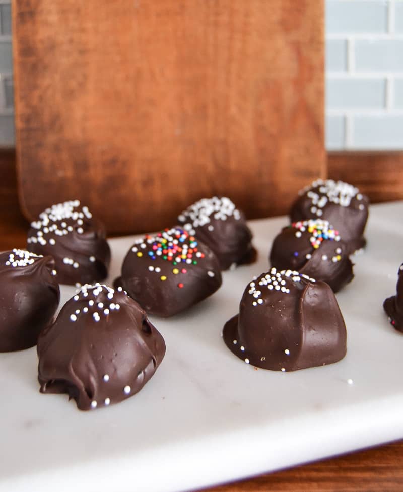 Looking for an easy recipe to make for your sweet tooth? These 3 Ingredient Oreo Cake Pops are rich, chocolate and so simple to make for holidays and parties! 