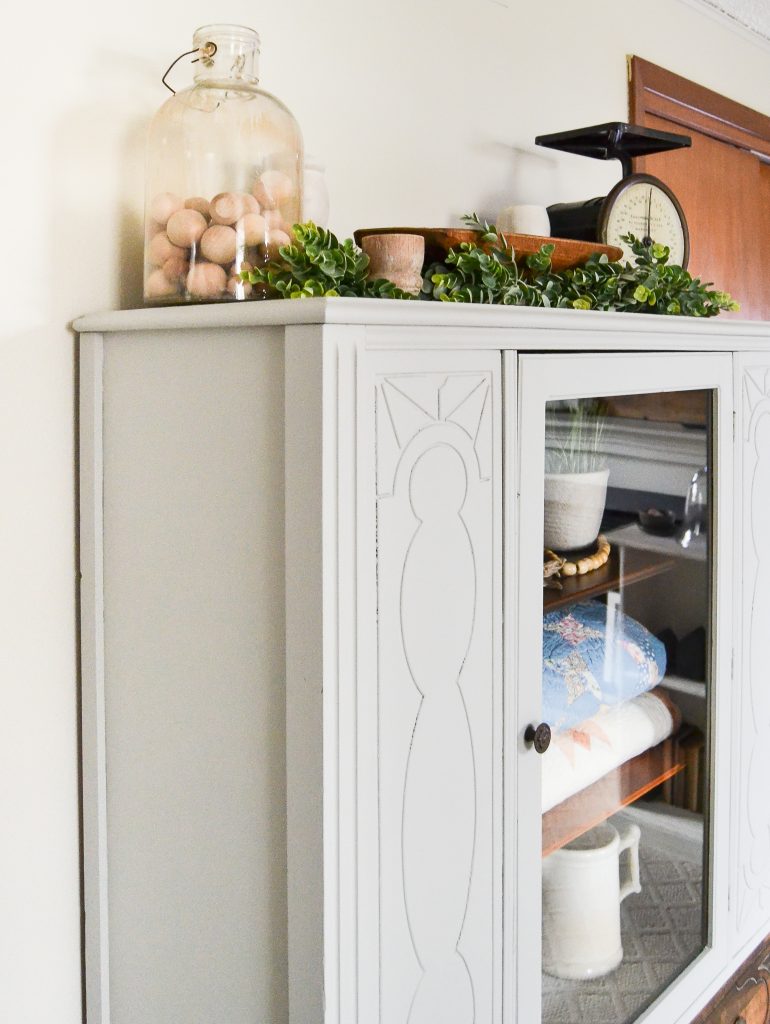 If you have a china cabinet that is in need of a makeover, click over to see how easy it was to transform this china cabinet to make it more relevant and less dingy.