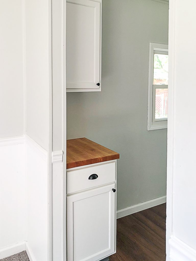 If you are thinking about adding unfinished wood cabinets to your home or a flip house, click over to see how we added them to our third project and what a difference they made to the kitchen.