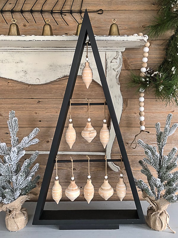If you are looking for an inexpensive way to have a Christmas tree that is unique and doesn't take up a lot of space, click over to see how to make this DIY Christmas tree with scrap wood!