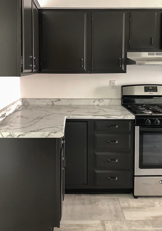 Looking for cabinet pulls for your kitchen? This post will show you how black cabinet pulls transformed the flip house kitchen.