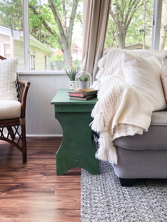 This yard sale find became a cute green bench though an easy makeover. A little paint, glaze and a surprise inside make this bench a fun piece for any room.