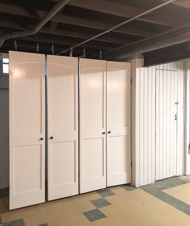 Hanging doors in the flip house was an easy and inexpensive solution to hide the mechanicals while still leaving them accessible if needed.