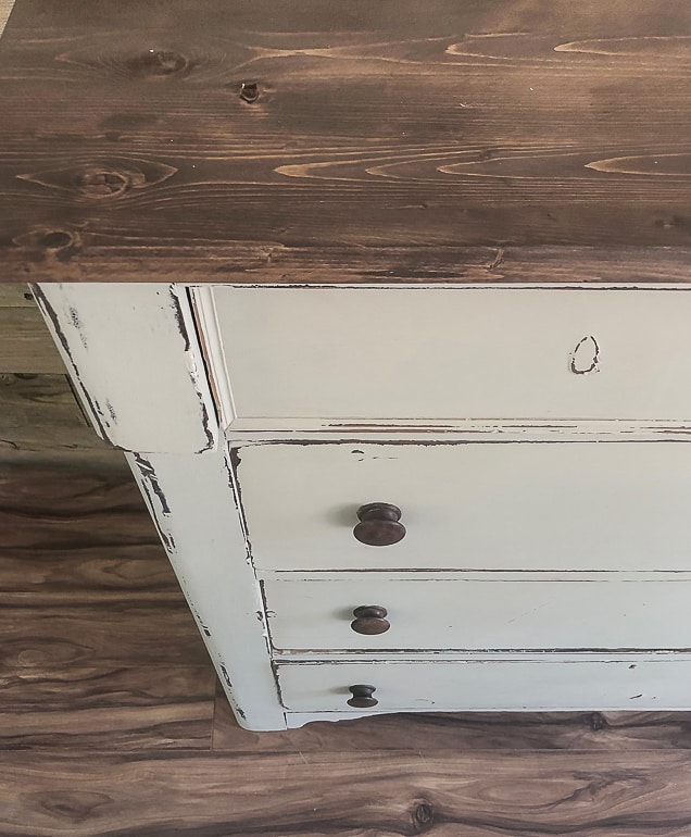 Painting furniture can be intimidating. This post will wall you through the easy steps and teach you how to paint a wooden dresser.