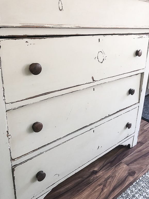 Painting furniture can be intimidating. This post will wall you through the easy steps and teach you how to paint a wooden dresser.