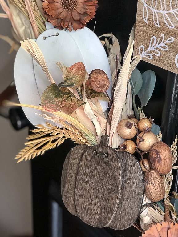 Wreaths are a great way to welcome a new season. This tutorial on how to make a fall wreath will show you how to make a fall wreath with thrifted finds.