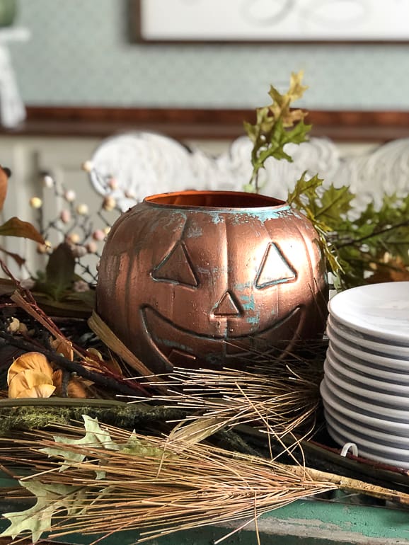 DIY Aged Copper Jack-O-Lanterns: Turn $1 Plastic Buckets into beautiful decor for Halloween, a Halloween party or a fall tablescape.