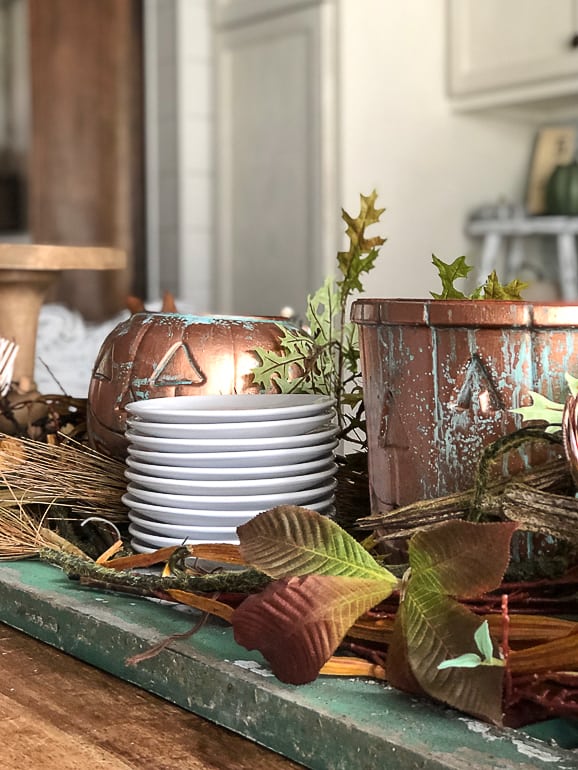 DIY Aged Copper Jack-O-Lanterns: Turn $1 Plastic Buckets into beautiful decor for Halloween, a Halloween party or a fall tablescape.