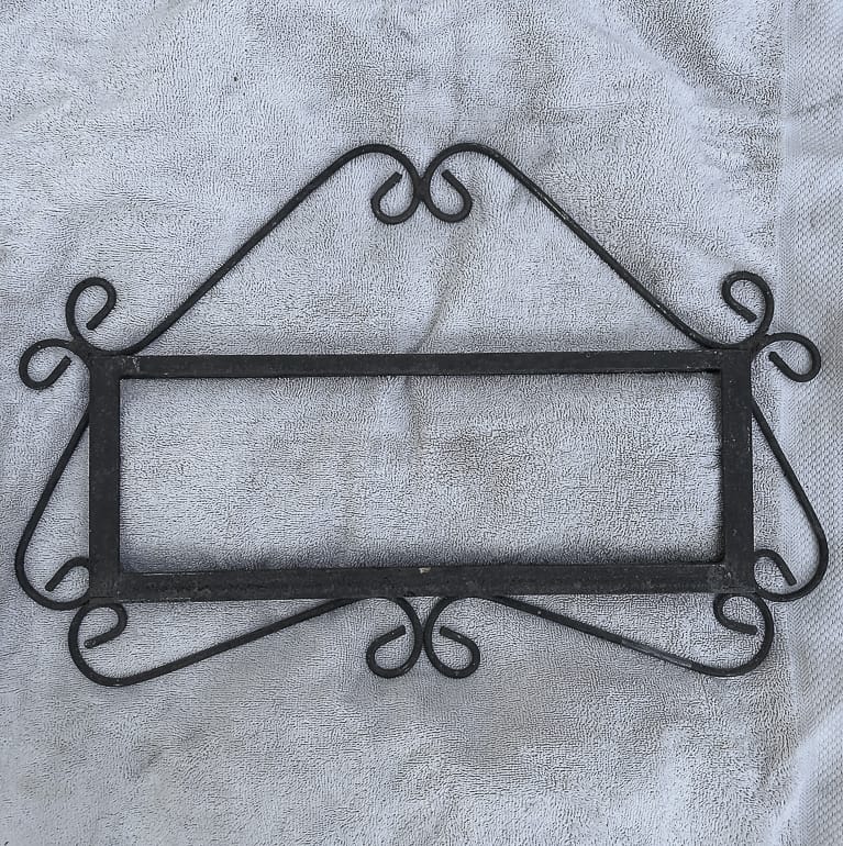 old iron sign frame