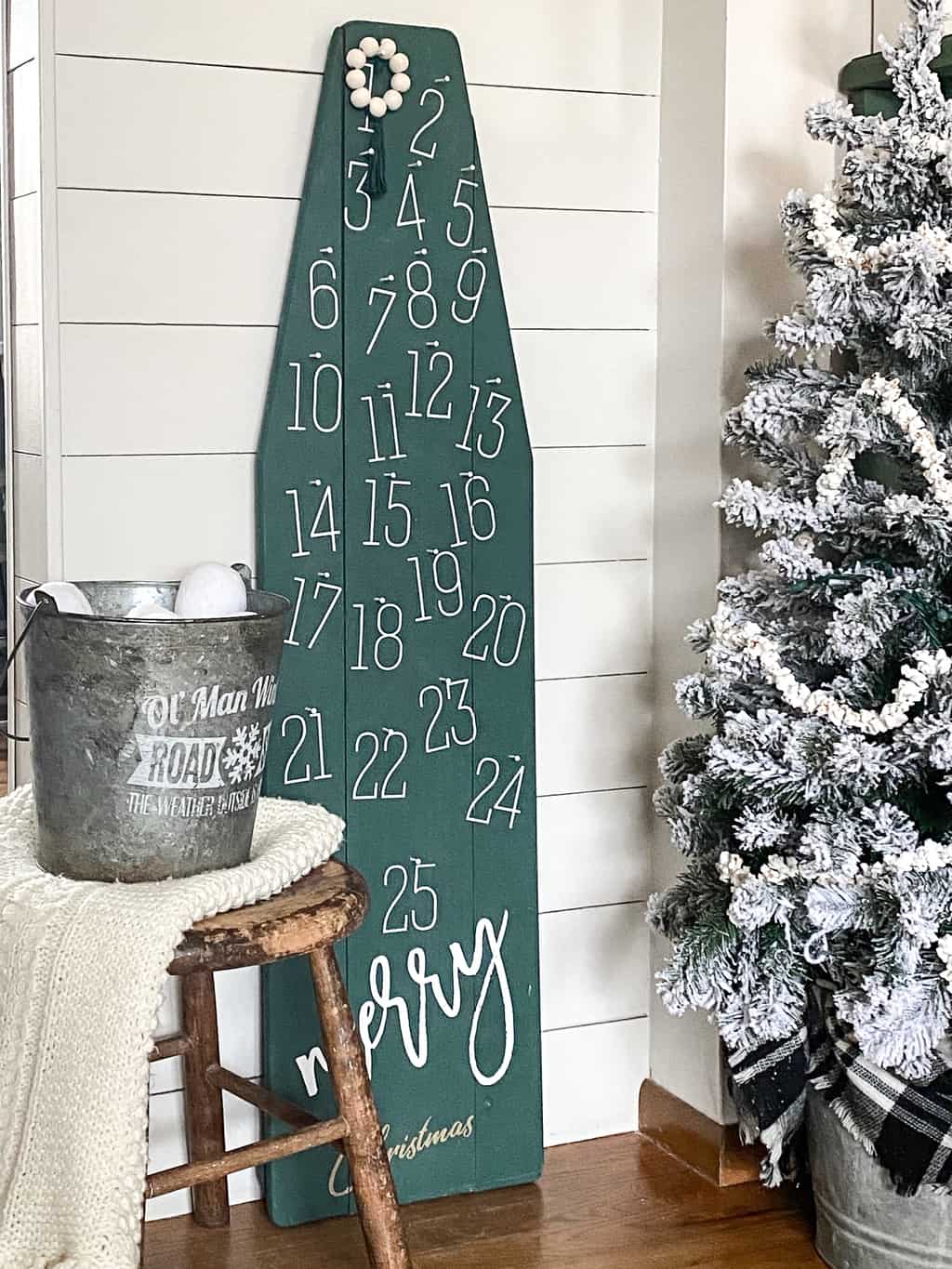 DIY Christmas Countdown - repurpose an old, wood ironing board into something festive for the holiday season that can be used for years and years.