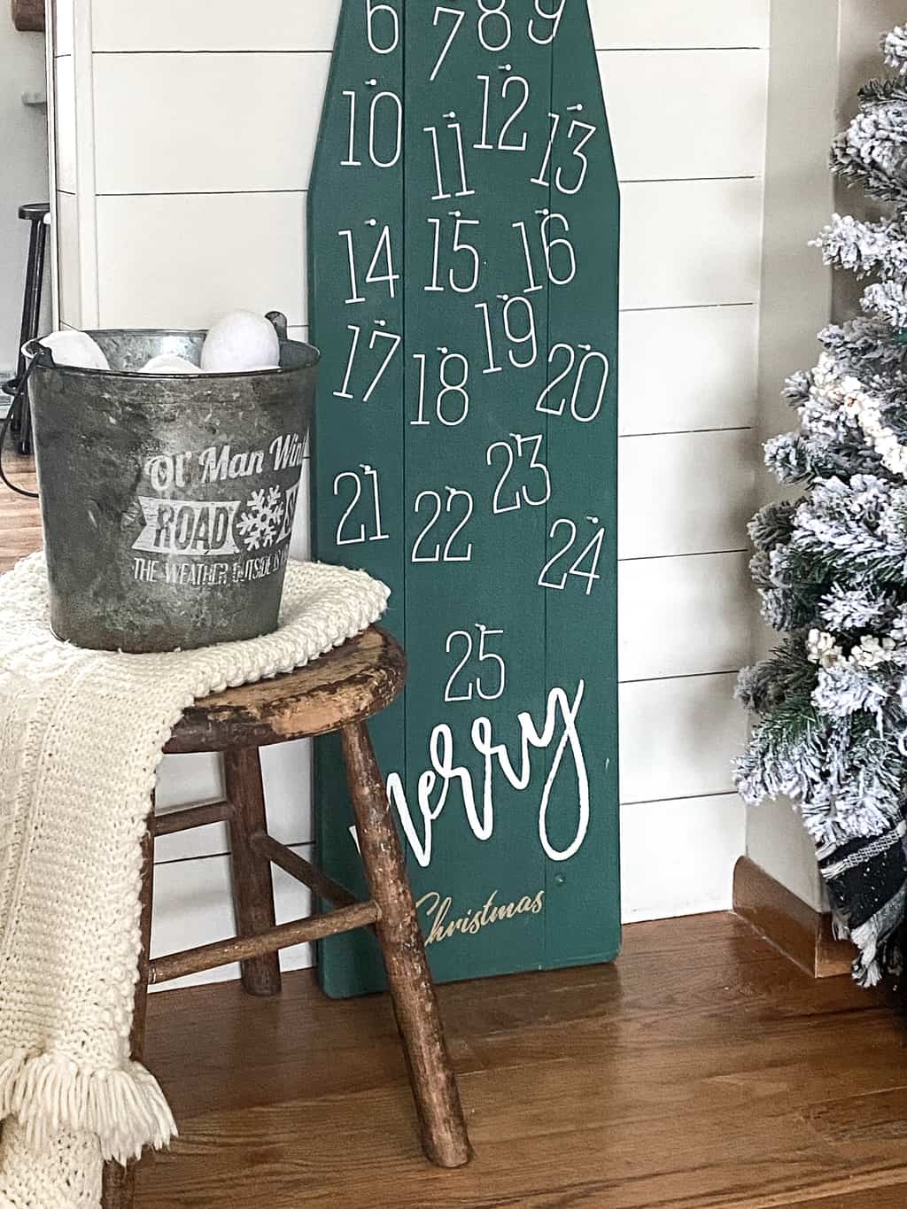 DIY Christmas Countdown - repurpose an old, wood ironing board into something festive for the holiday season that can be used for years and years.