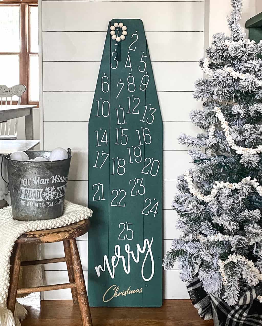 DIY Christmas Countdown - repurpose an old, wood ironing board into something festive for the holiday season that can be used for years and years.