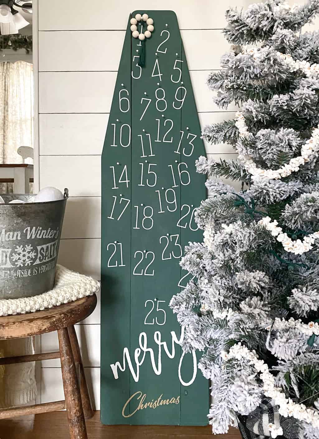 DIY Christmas Countdown - repurpose an old, wood ironing board into something festive for the holiday season that can be used for years and years.