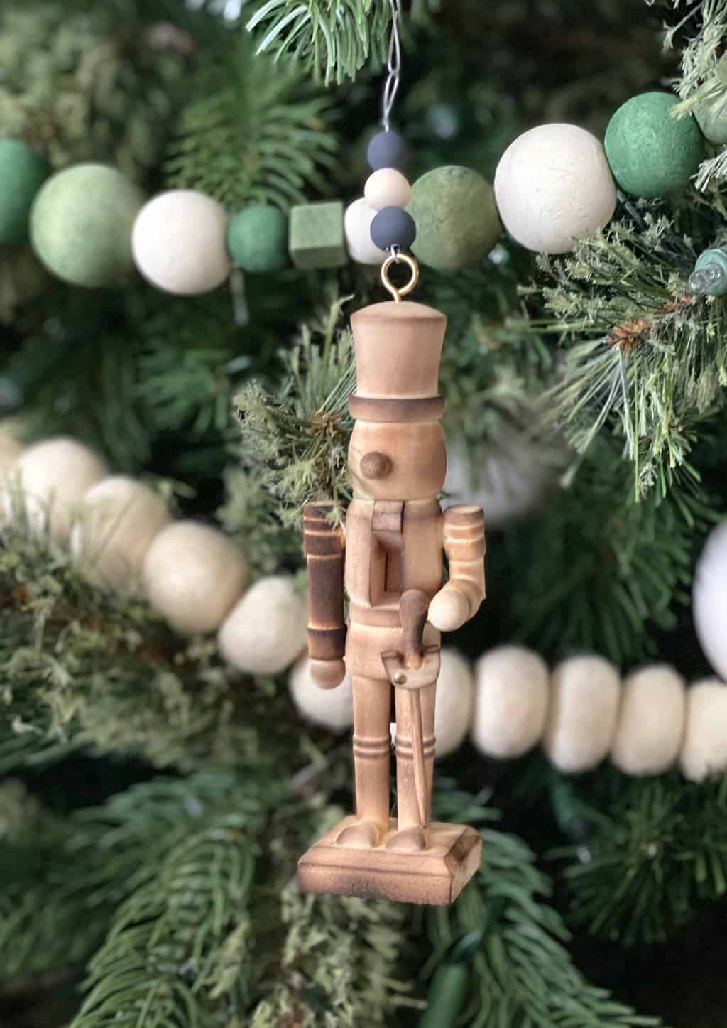 Looking for a cute homemade ornament idea? These DIY Nutcracker Christmas ornaments are easy to make and so cute hanging on the tree.
