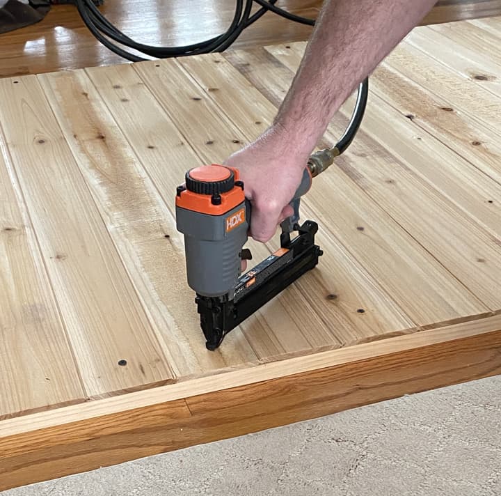 nail gun to attach the planks to the frame.