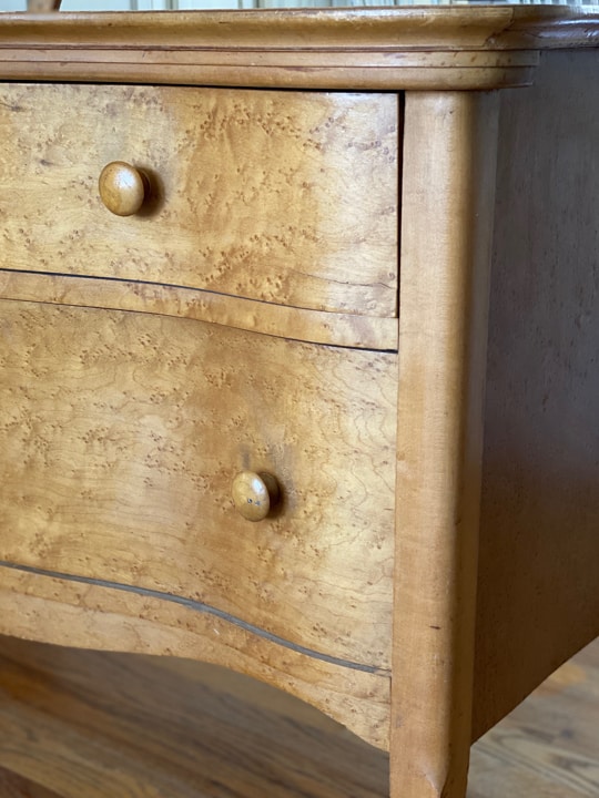 This Bird's Eye Maple Dresser Makeover tutorial shows you how to brings life to an old piece in a big way with some cleaning, a fun paint color and wax!