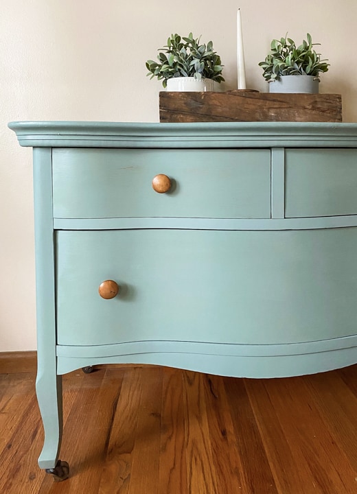 This Bird's Eye Maple Dresser Makeover tutorial shows you how to brings life to an old piece in a big way with some cleaning, a fun paint color and wax!