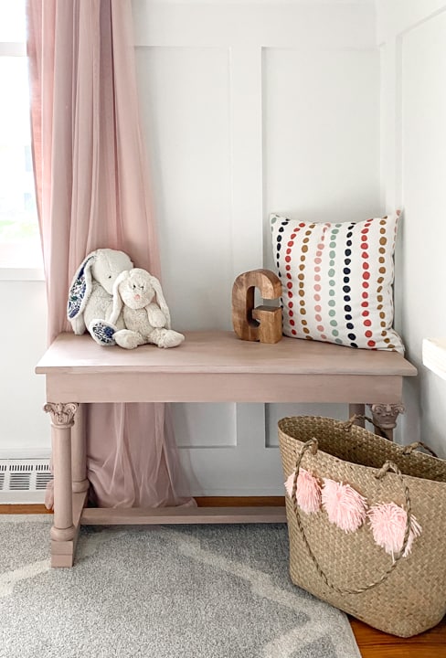 An old piano bench that called for a Pretty in Pink Bench Makeover to highlight the details on the legs and make it beautiful again.
