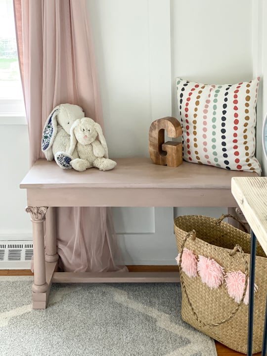 An old piano bench that called for a Pretty in Pink Bench Makeover to highlight the details on the legs and make it beautiful again.
