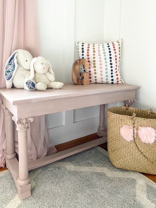 An old piano bench that called for a Pretty in Pink Bench Makeover to highlight the details on the legs and make it beautiful again.