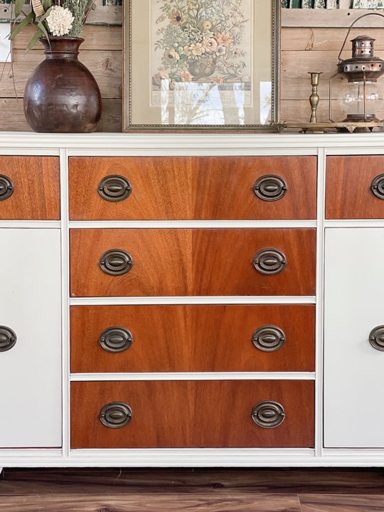 Buffets are a versatile piece of furniture and this creamy white boho buffet makeover turned a boring piece into a boho show stopper!