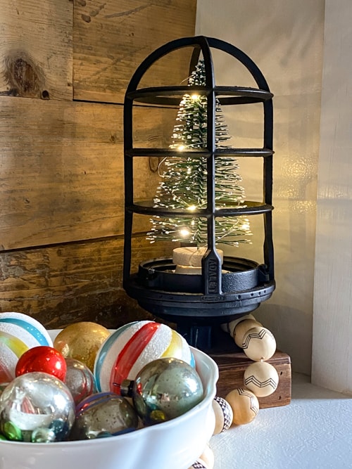 This DIY upcycled Christmas tree lantern was an easy project that repurposed an old light into a great piece of decor for the holidays!
