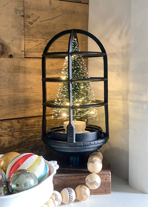 This DIY upcycled Christmas tree lantern was an easy project that repurposed an old light into a great piece of decor for the holidays!