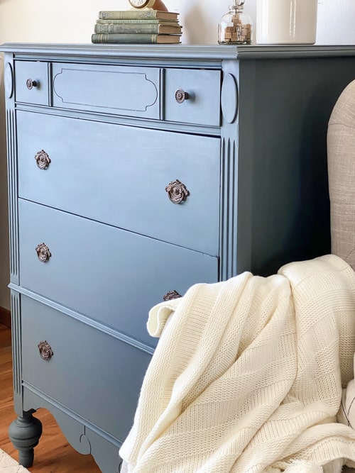 This blue painted dresser makes a yard sale dresser beautiful again with sanding, repairs, paint, topcoat, and a little elbow grease.