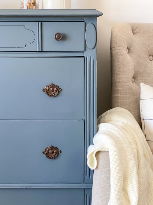 This blue painted dresser makes a yard sale dresser beautiful again with sanding, repairs, paint, topcoat, and a little elbow grease.