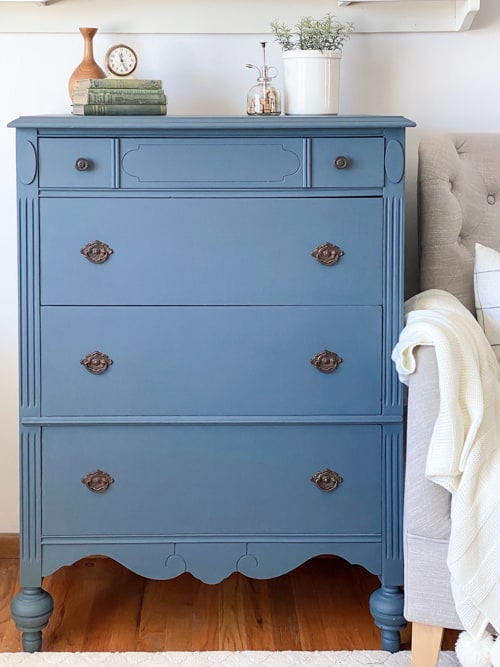 This blue painted dresser makes a yard sale dresser beautiful again with sanding, repairs, paint, topcoat, and a little elbow grease.