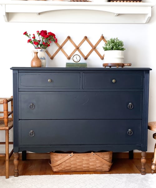 This painted black dresser makeover is a step-by-step tutorial showing how to take an old piece and make it beautiful and functional again.