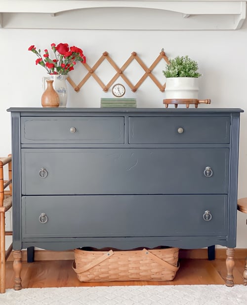 This painted black dresser makeover is a step-by-step tutorial showing how to take an old piece and make it beautiful and functional again.