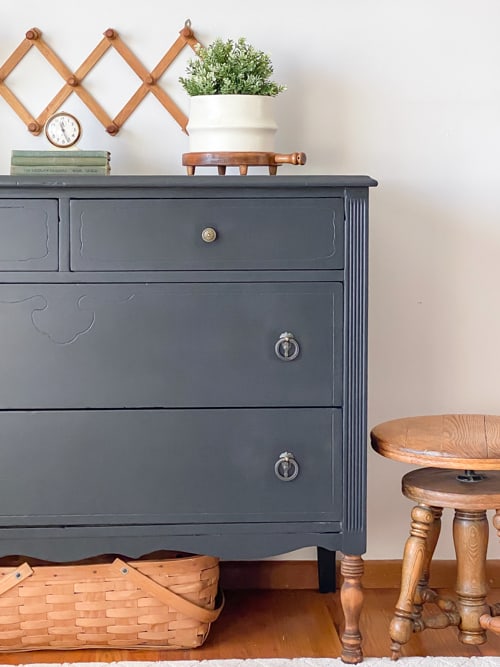 This painted black dresser makeover is a step-by-step tutorial showing how to take an old piece and make it beautiful and functional again.