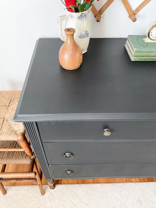 This painted black dresser makeover is a step-by-step tutorial showing how to take an old piece and make it beautiful and functional again.