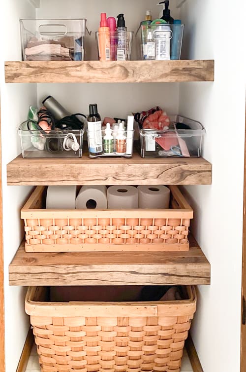 This DIY linen closet makeover was an easy and inexpensive project that not only made it look better but it functioned so much better too.