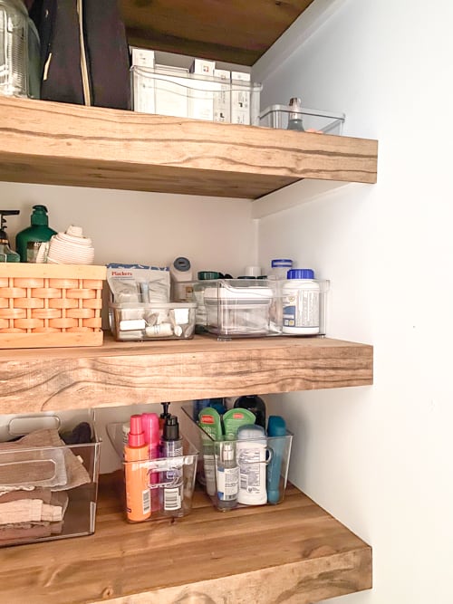 This DIY linen closet makeover was an easy and inexpensive project that not only made it look better but it functioned so much better too.