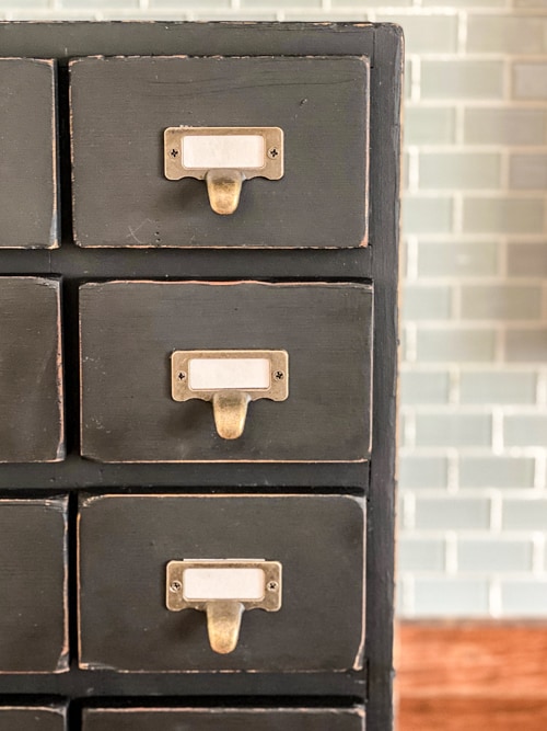 This DIY Small Apothecary Cabinet Makeover takes a thrift store find and turns it into something pretty and functional for any style home.