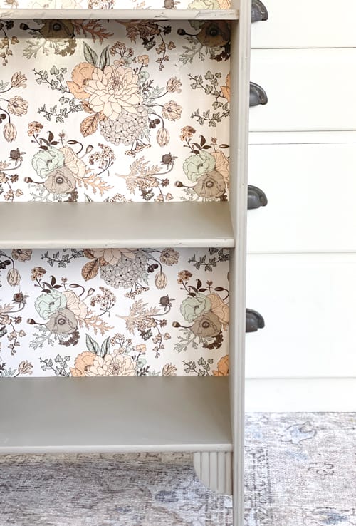 This vintage bookcase makeover used stripper, paint, and wrapping paper to update it and make it beautiful and functional for years to come.