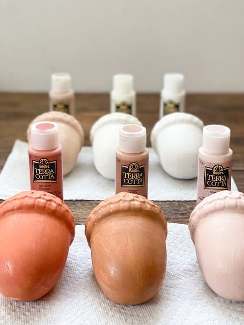 These DIY terra cotta acorns were very easy to make with two paint products and ceramic acorns from the dollar store.