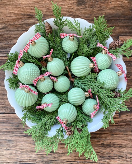 These DIY Jadeite Christmas Ornaments are so easy to make and give the look of vintage jadeite glassware that is so pretty and popular.