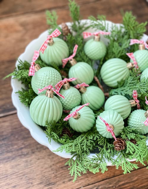 These DIY Jadeite Christmas Ornaments are so easy to make and give the look of vintage jadeite glassware that is so pretty and popular.