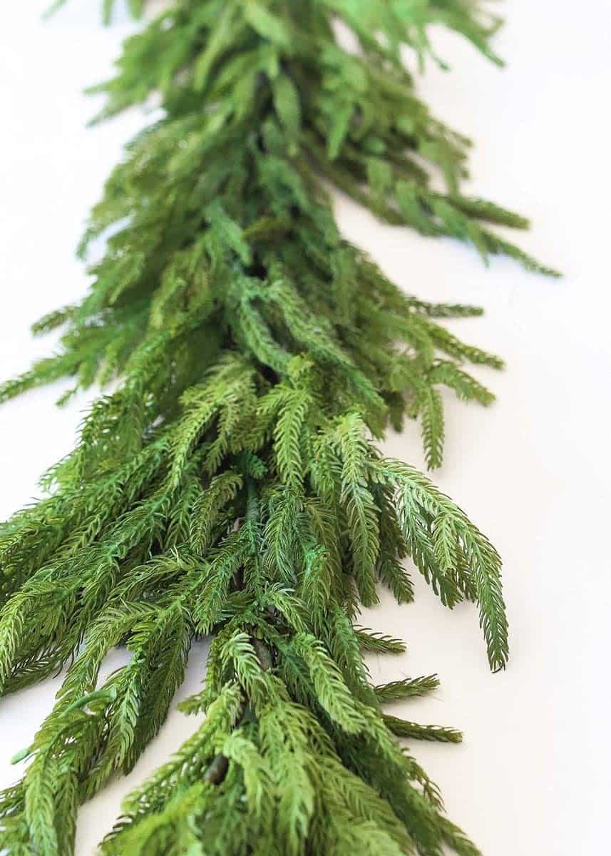 The best artificial garlands that give you the look of real greenery during the holidays and will never die so you can use them forever.