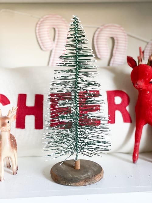 Small Christmas tree bases can be boring. These DIY Christmas Tree Bases add tons of charm and character to any small Christmas tree.