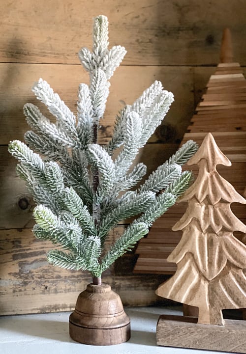 Small Christmas tree bases can be boring. These DIY Christmas Tree Bases add tons of charm and character to any small Christmas tree.