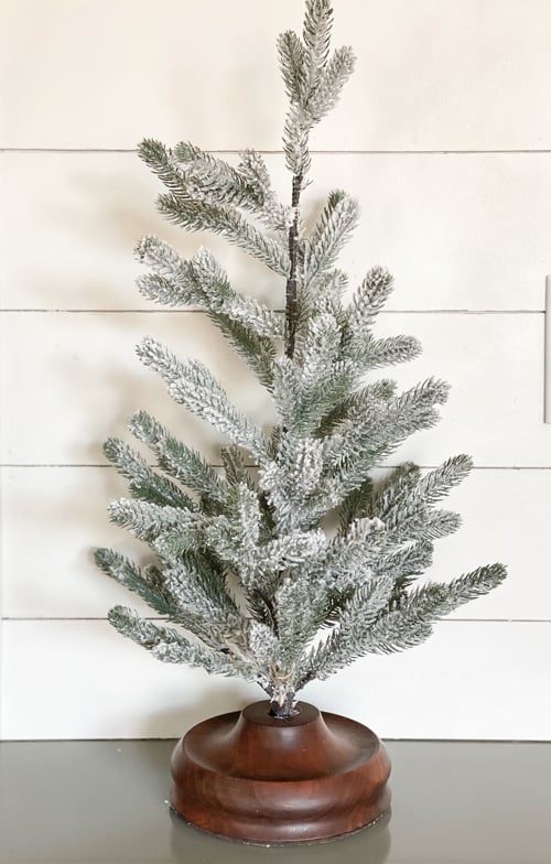 Small Christmas tree bases can be boring. These DIY Christmas Tree Bases add tons of charm and character to any small Christmas tree.