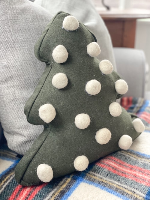 Christmas Tree Pillow Tutorial - Arrange the pom poms on the pillow front  to your liking - WeAllSew